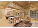 Game room with two billiards tables, wood-trimmed windows, and seating area at 3977 Sweet Bottom Dr, Duluth, GA 30096