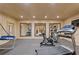 Bright home gym featuring treadmill, bike, mirrors, and space for workout equipment at 3977 Sweet Bottom Dr, Duluth, GA 30096