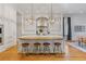 Elegant kitchen with white cabinets, marble countertops, a large island, and pendant lighting at 3977 Sweet Bottom Dr, Duluth, GA 30096