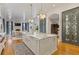 Gourmet kitchen with a marble island, farmhouse sink, custom cabinets, and an open layout at 3977 Sweet Bottom Dr, Duluth, GA 30096
