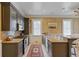 Elegant kitchen featuring black cabinets, granite countertops, and stainless steel appliances at 3977 Sweet Bottom Dr, Duluth, GA 30096