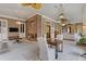 Sunroom with a brick fireplace and a variety of chairs and tables for seating and entertainment at 3977 Sweet Bottom Dr, Duluth, GA 30096