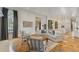 Open-concept living area with a fireplace, lots of natural light, and direct access to the kitchen at 3977 Sweet Bottom Dr, Duluth, GA 30096