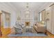 Elegant living room with a fireplace, chandelier, and neutral color palette at 3977 Sweet Bottom Dr, Duluth, GA 30096