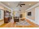 Comfortable living room featuring hardwood floors, dark wood accents, and an ornate mirror at 3977 Sweet Bottom Dr, Duluth, GA 30096