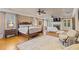 Elegant bedroom boasts a fireplace, seating area, and large windows for ample natural light at 3977 Sweet Bottom Dr, Duluth, GA 30096