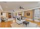 Spacious bedroom with hardwood floors, seating area, and large windows for natural light at 3977 Sweet Bottom Dr, Duluth, GA 30096