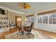Spacious office with bookshelves, decorative fan, hardwood floors, and natural light at 3977 Sweet Bottom Dr, Duluth, GA 30096