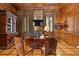 Well appointed office area featuring wood paneled walls and herringbone hardwood floors at 3977 Sweet Bottom Dr, Duluth, GA 30096