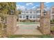Elegant pool area featuring brick pillars and a stone patio at 3977 Sweet Bottom Dr, Duluth, GA 30096