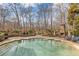 The property offers a spacious backyard pool, brick chimney, and beautiful hardscape with lounge chairs at 3977 Sweet Bottom Dr, Duluth, GA 30096