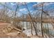 Scenic view of a tranquil river with stone steps leading down to the water's edge at 3977 Sweet Bottom Dr, Duluth, GA 30096