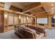 Home theater with tiered seating, wood trim, sconces, and large screen at 3977 Sweet Bottom Dr, Duluth, GA 30096