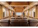 Comfortable home theater with leather seating, a projector screen and wooden panels at 3977 Sweet Bottom Dr, Duluth, GA 30096