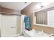 Bathroom with neutral decor, shower-tub combo, and updated fixtures at 60 Mountain View Cir, Covington, GA 30016
