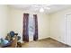 Bedroom features a window, a ceiling fan, and neutral walls at 60 Mountain View Cir, Covington, GA 30016