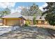 Charming single-Gathering home with attached two car garage and a well-maintained front yard at 60 Mountain View Cir, Covington, GA 30016