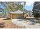 Single-Gathering home featuring a driveway leading to an attached two-car garage and tree lined property at 60 Mountain View Cir, Covington, GA 30016