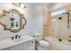 Well-lit bathroom with modern fixtures, a tub, and a tiled shower at 165 Ansley Way, Roswell, GA 30075