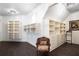 Spacious walk-in closet featuring ample shelving and custom drawers for organized storage at 165 Ansley Way, Roswell, GA 30075