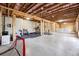 Unfinished basement with concrete floor, exposed ceiling, and the framing is installed at 6375 Haystack Ct, Cumming, GA 30040