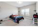 Cozy bedroom with carpet, a twin bed, and a bright window, creating a comfortable living space at 6375 Haystack Ct, Cumming, GA 30040