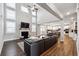 Bright open living room showcasing a fireplace and view into the kitchen and breakfast nook at 6375 Haystack Ct, Cumming, GA 30040