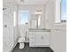 Bathroom featuring tiled shower, vanity, and hexagon tile floors at 697 Fayetteville Road, Atlanta, GA 30316