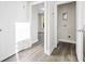 Hallway with white doors, trim, and new wood floors at 697 Fayetteville Road, Atlanta, GA 30316