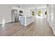 Modern kitchen featuring a stylish island, stainless steel appliances, and gray flooring at 697 Fayetteville Road, Atlanta, GA 30316