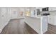 Modern kitchen featuring a stylish island, stainless steel appliances, and gray flooring at 697 Fayetteville Road, Atlanta, GA 30316