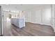 Modern kitchen featuring a stylish island, stainless steel appliances, and gray flooring at 697 Fayetteville Road, Atlanta, GA 30316