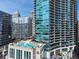 Exterior view of the building with a rooftop pool and lounge area showcasing upscale city living at 1080 Peachtree Ne St # 2807, Atlanta, GA 30309