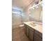 Bright bathroom with a shower-tub combo, modern vanity, and wood-look flooring at 3086 Zodiac Ct, Lawrenceville, GA 30044