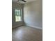An empty bedroom featuring wood floors and large windows at 3086 Zodiac Ct, Lawrenceville, GA 30044