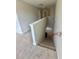 Carpeted staircase with white banister leading to the upper level at 3086 Zodiac Ct, Lawrenceville, GA 30044