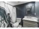 Bathroom showcasing a dark gray patterned shower curtain, vanity, and modern mirror at 3186 Quail Ct, Decatur, GA 30034