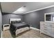 Bedroom with gray walls, wood floor and furniture at 3186 Quail Ct, Decatur, GA 30034