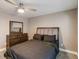 Charming bedroom with a dresser, large mirror, and ceiling fan at 3186 Quail Ct, Decatur, GA 30034