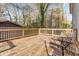 Spacious wooden deck perfect for outdoor dining and entertaining with views of the wooded yard at 3186 Quail Ct, Decatur, GA 30034