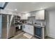 This modern kitchen has stainless steel appliances, white cabinets, and a subway tile backsplash at 3186 Quail Ct, Decatur, GA 30034