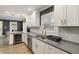 Well-lit kitchen features white cabinetry, subway tile backsplash, gray countertops, and stainless steel appliances at 3186 Quail Ct, Decatur, GA 30034