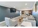 Open-concept living room with dark accent wall and modern furniture at 3186 Quail Ct, Decatur, GA 30034
