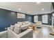 Spacious living room with gray accent wall and modern furniture at 3186 Quail Ct, Decatur, GA 30034