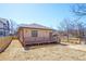 The backyard features a new wooden fence, a back porch, and an unfinished yard at 1253 Lucile Sw Ave, Atlanta, GA 30310