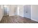 Spacious bedroom with hardwood floors, two doorways, and a double door closet at 1253 Lucile Sw Ave, Atlanta, GA 30310