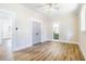 Spacious bedroom with hardwood floors, two doorways, and a window for natural light at 1253 Lucile Sw Ave, Atlanta, GA 30310