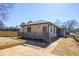 A well-maintained home exterior with a new wooden fence, a large yard, and new siding at 1253 Lucile Sw Ave, Atlanta, GA 30310