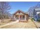 Traditional home with a covered porch, complemented by meticulous landscaping at 1253 Lucile Sw Ave, Atlanta, GA 30310