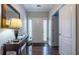 Inviting foyer featuring hardwood floors, a console table, and a front door with sidelights at 26 Crescent Ln, Dallas, GA 30157